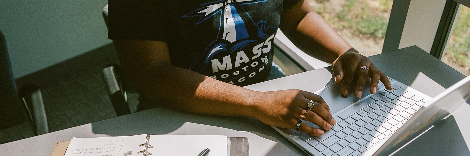student works on a laptop.