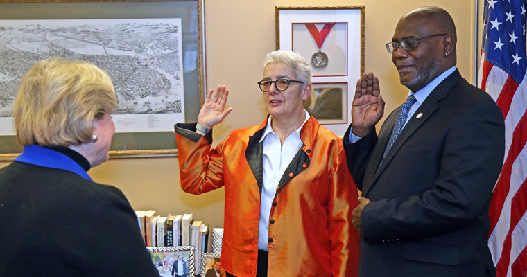 Professor of Latin American and Iberian Studies Reyes Coll-Tellechea, center, with City Clerk Maureen Feeney and the Hon. Leslie Harris