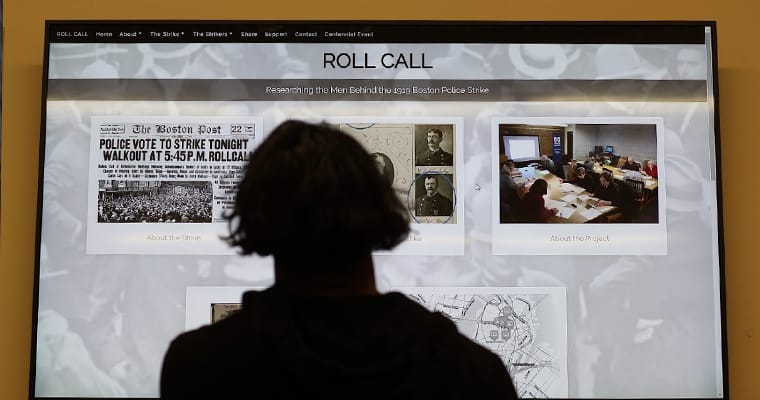 A student checks out the Roll Call website